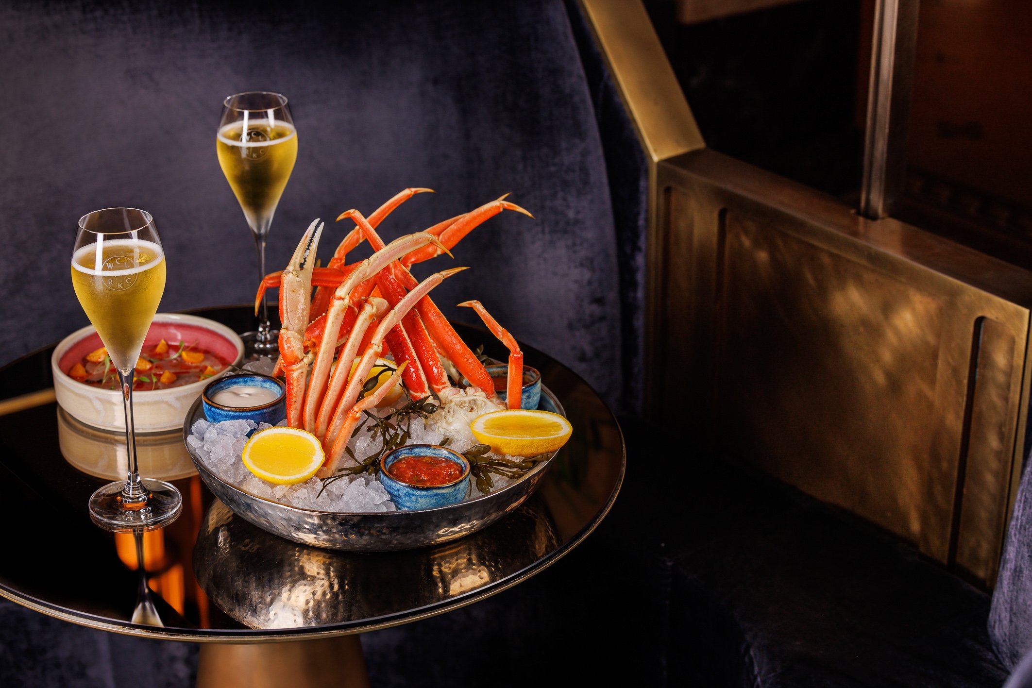 Crab legs and drinks served at Fairmont Royal's lobby bar, Clockwork.