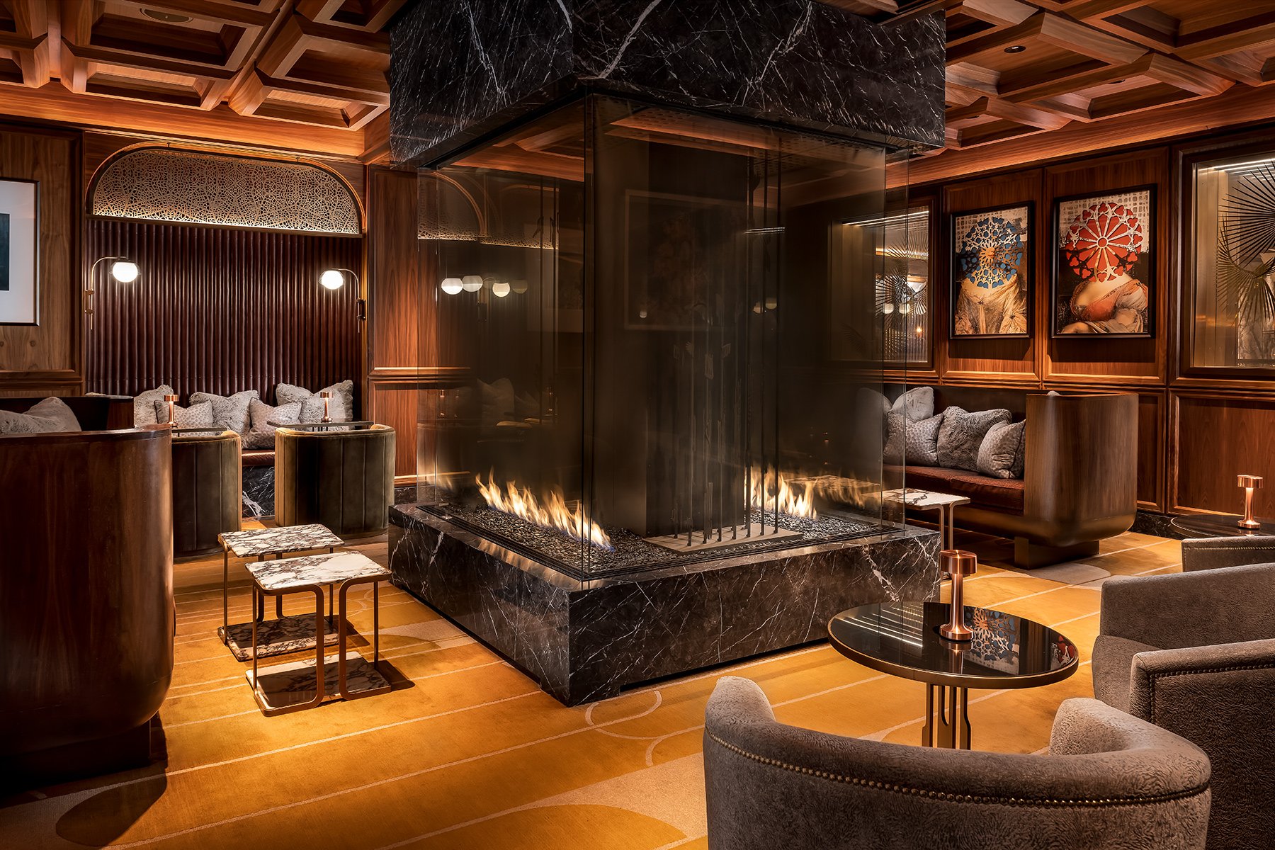 Seating around the fireplace at Reign Restaurant, Bar & Bakery in Toronto