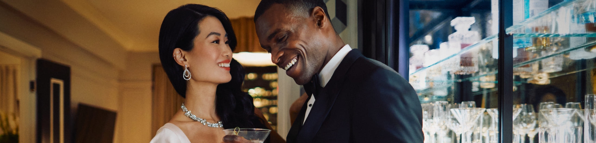 A couple in formalwear having drinks in Fairmont Royal York's Gold Lounge.