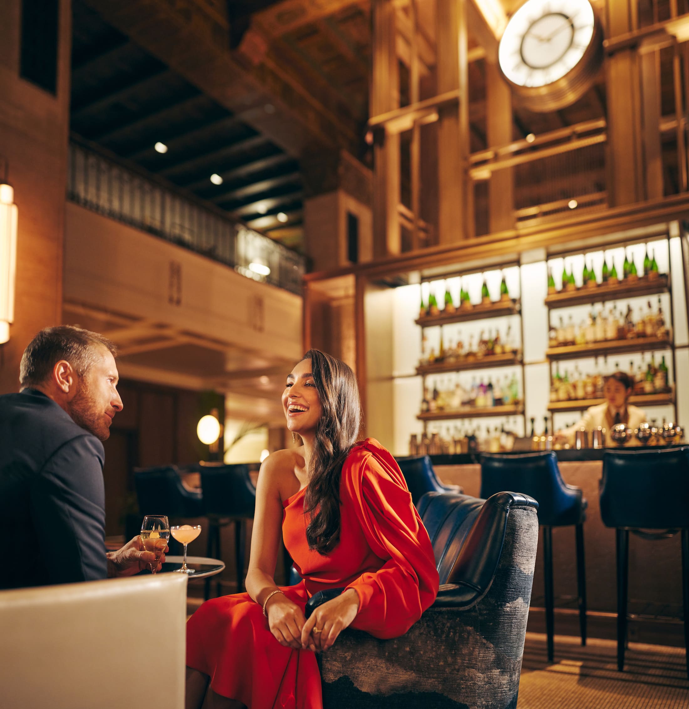 A couple having drinks in Fairmont Royal York's lobby bar, Clockwork, in downtown Toronto.