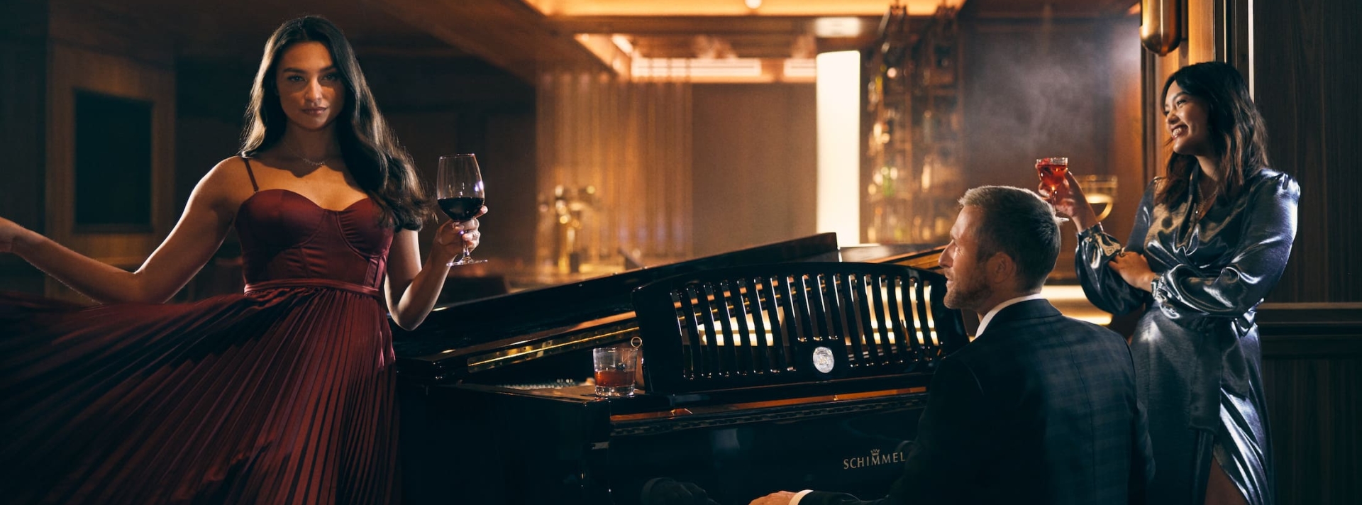 Two women having drinks with the piano player at Fairmont Royal York.