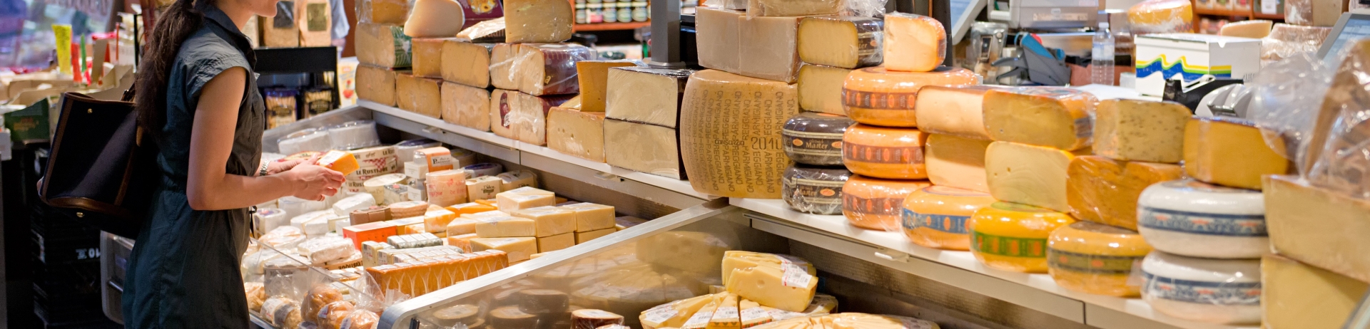 A woman buying cheese at Toronto's St Lawrence Market