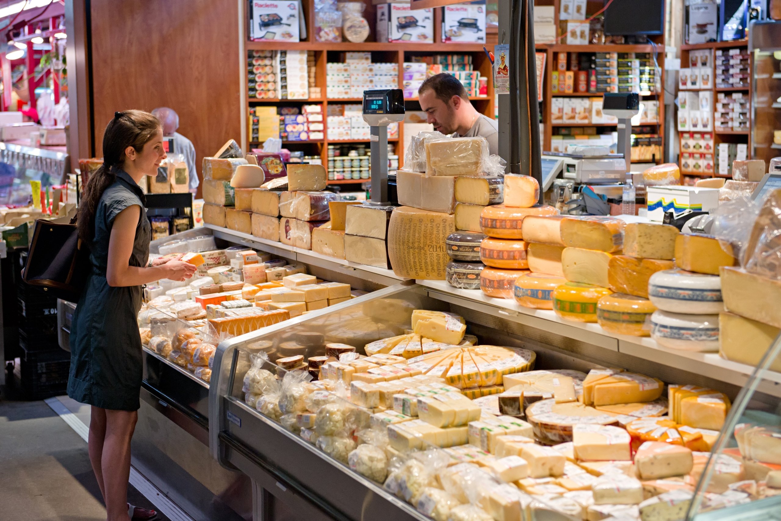 A woman buying cheese at Toronto's St Lawrence Market