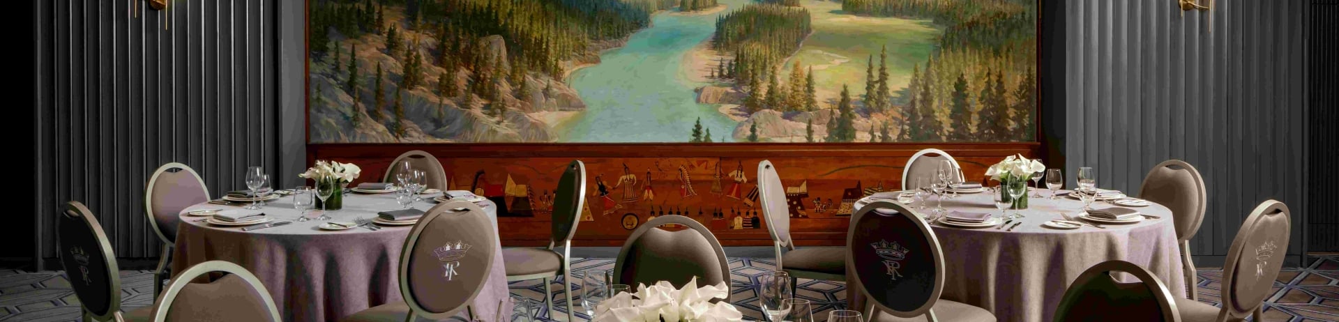 An event room at Fairmont Royal York Hotel in Toronto set up for a dinner event.